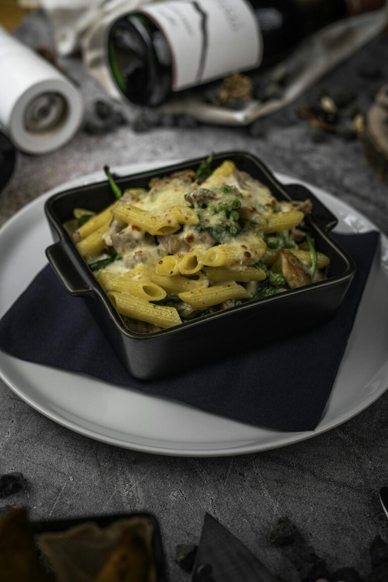 Tantalizing baked pasta dish with melted cheese and vegetables, perfect for food lovers.